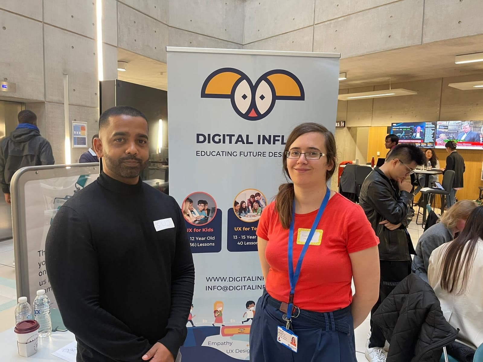 Two Digital Influx team members beside the Educating Future Designers banner, showing the UX for Kids and UX for Teens courses.